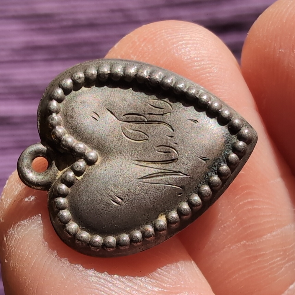 Antique sterling silver puffed heart charm